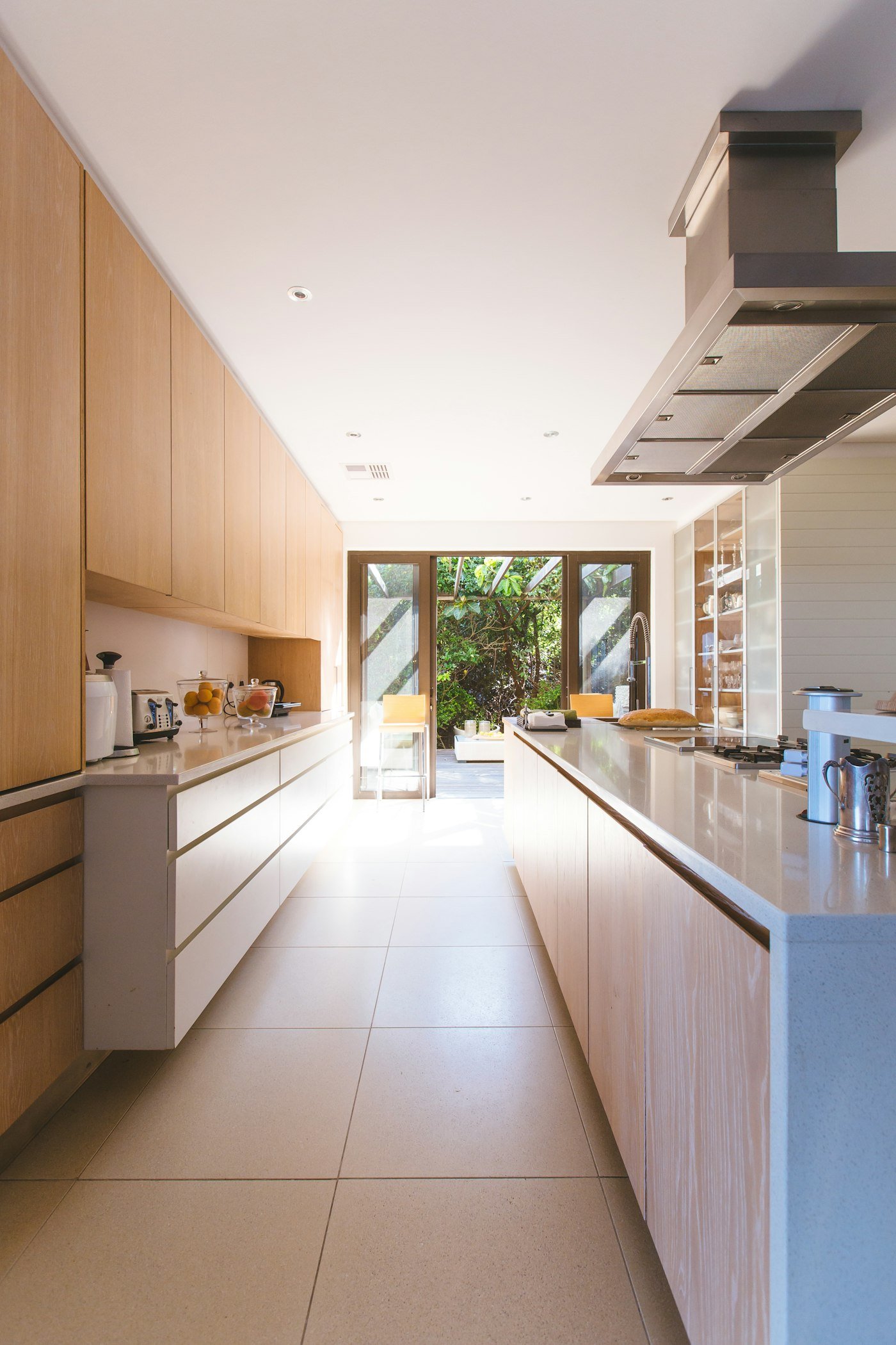 Kitchen of a managed residence opening to a garden